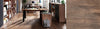 Modern office setup with wooden desks and bookshelves.