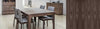 Wooden dining table with chairs in a kitchen setting