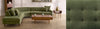 Green sectional sofa in a living room setting with a close-up of the fabric texture.